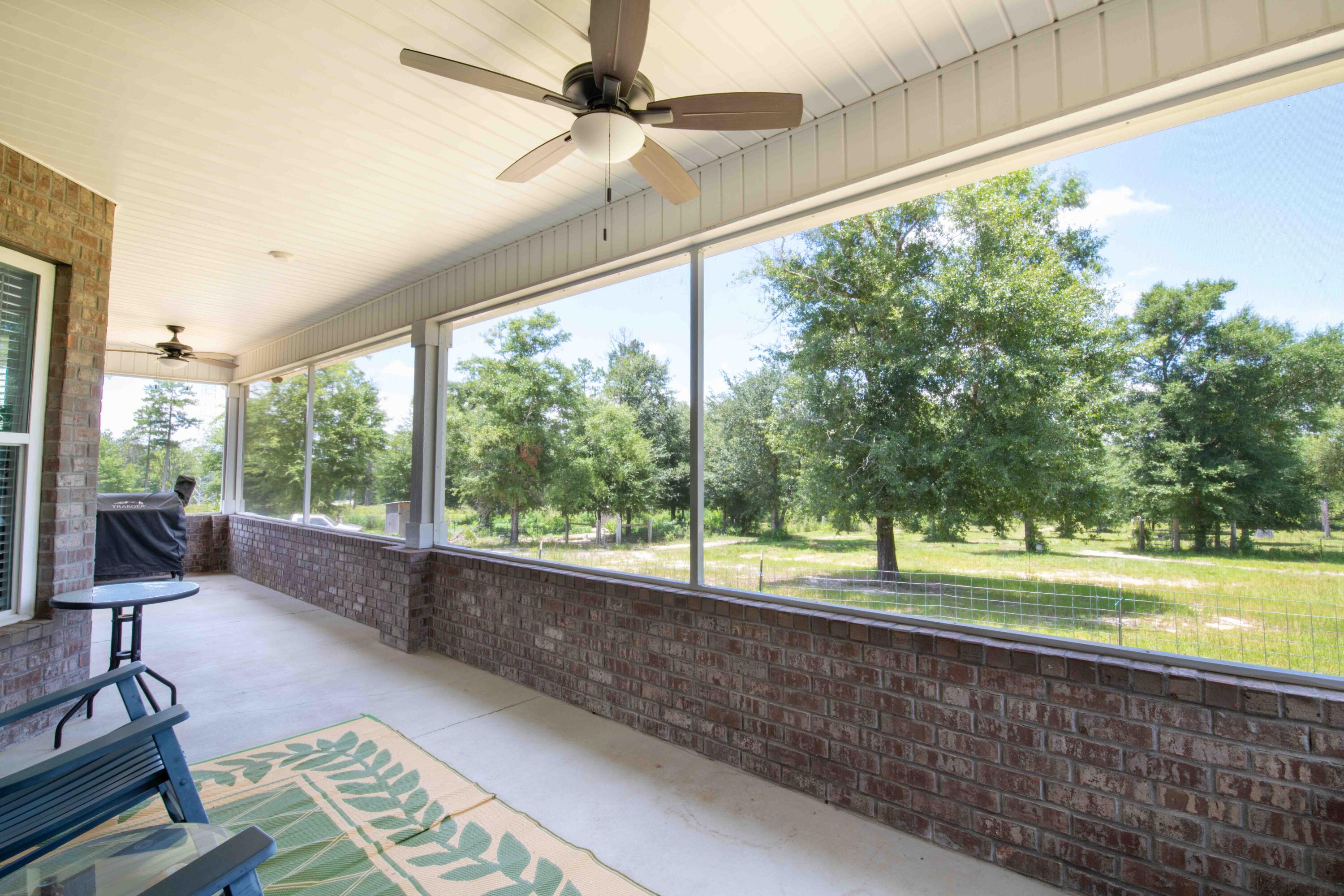 6249 Highway 4 Baker, FL 32531 - Photo 19 of 37 a view of a porch with furniture and a yard