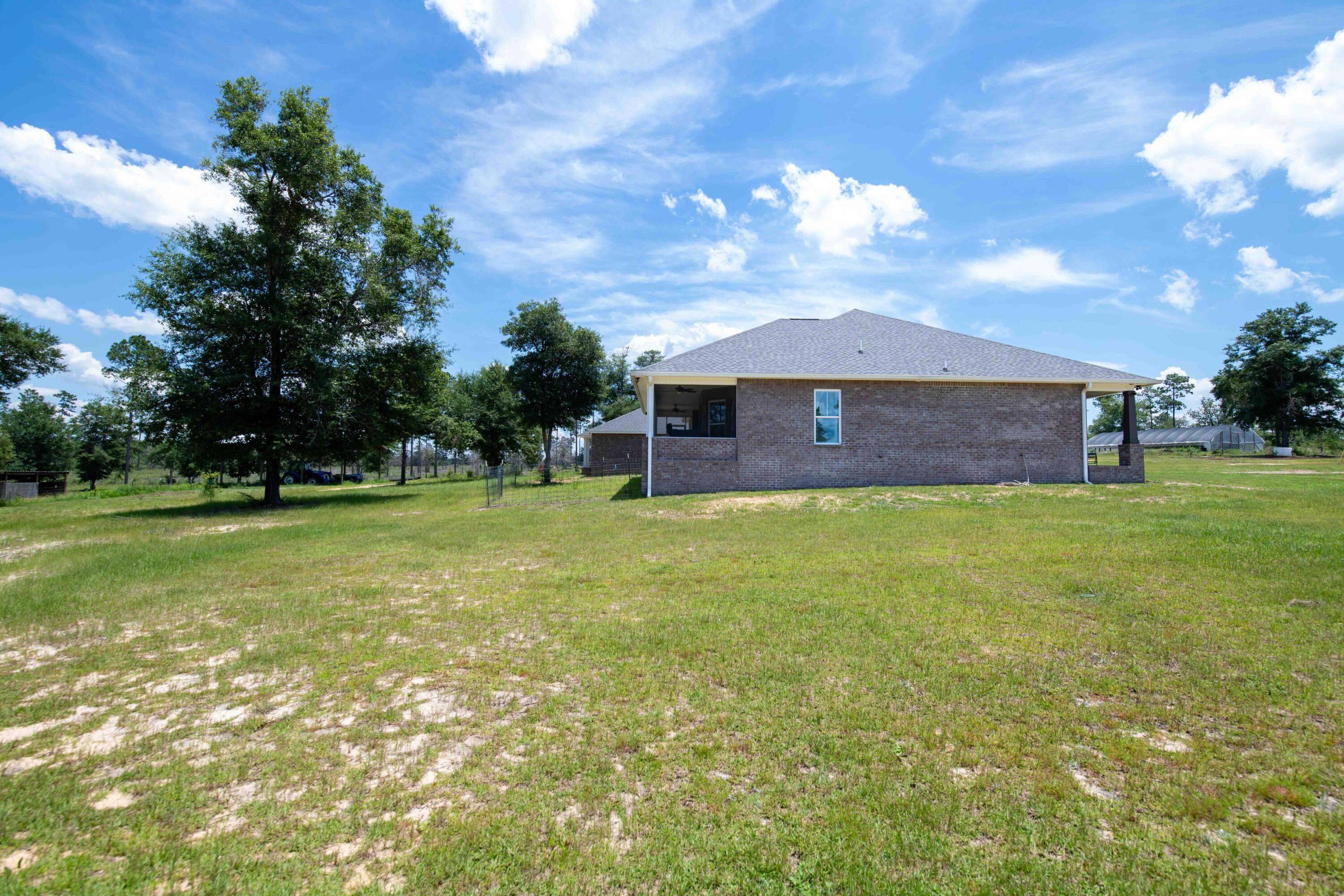 6249 Highway 4 Baker, FL 32531 - Photo 25 of 37 a front view of house with a garden