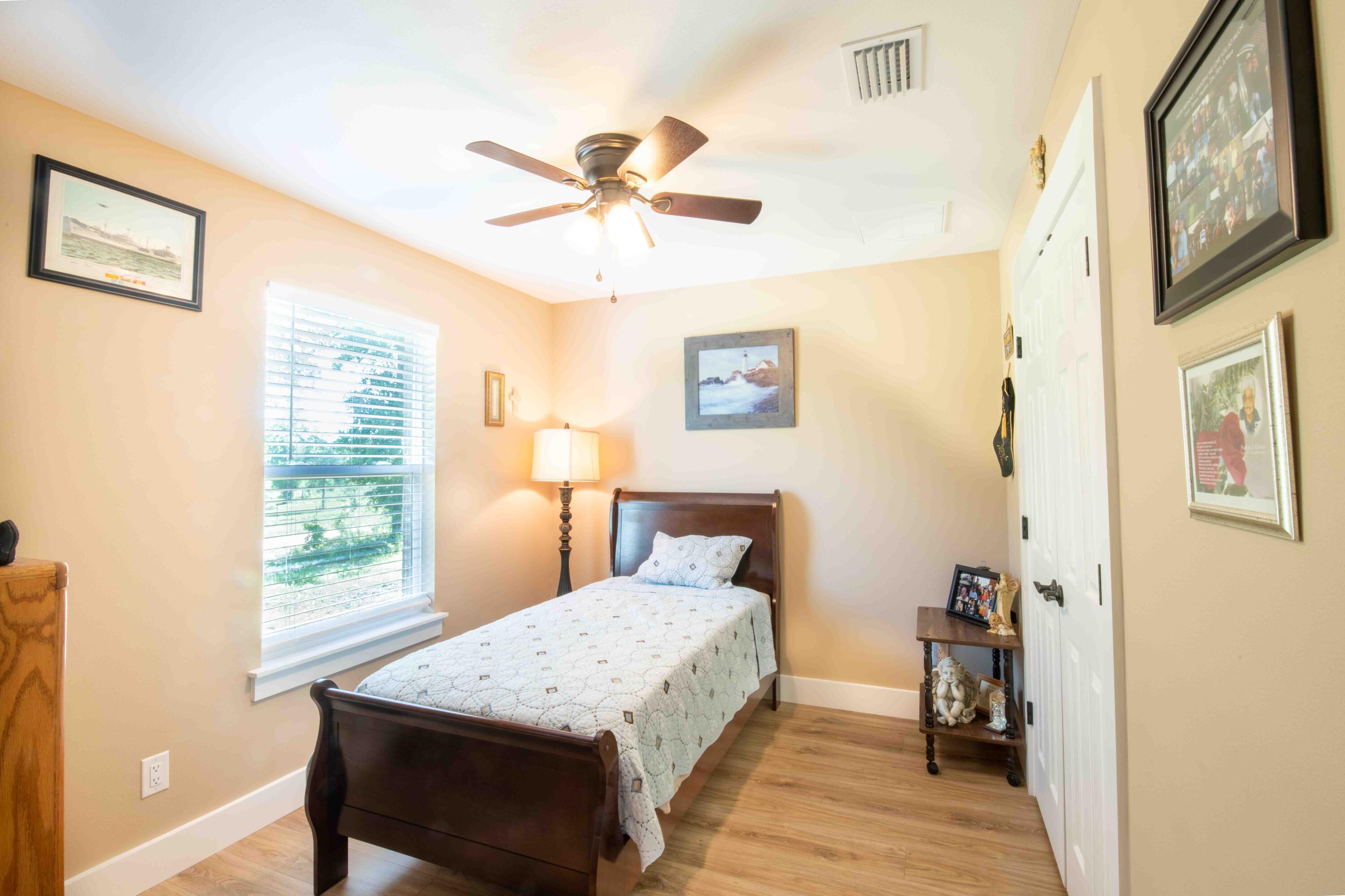 6249 Highway 4 Baker, FL 32531 - Photo 28 of 37 a bedroom with a bed and a window