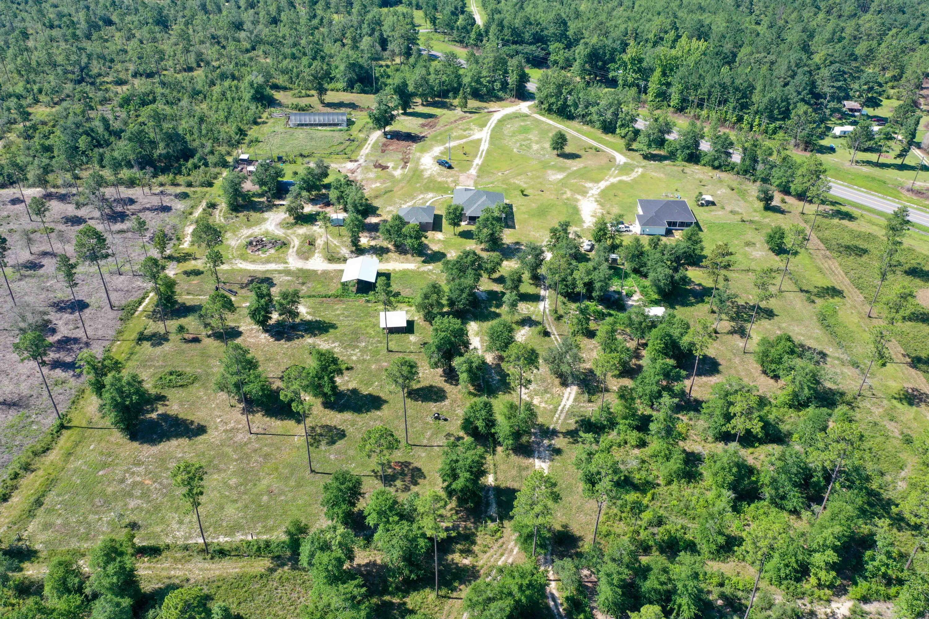 6249 Highway 4 Baker, FL 32531 - Photo 33 of 37 an aerial view of a house with a yard and swimming pool