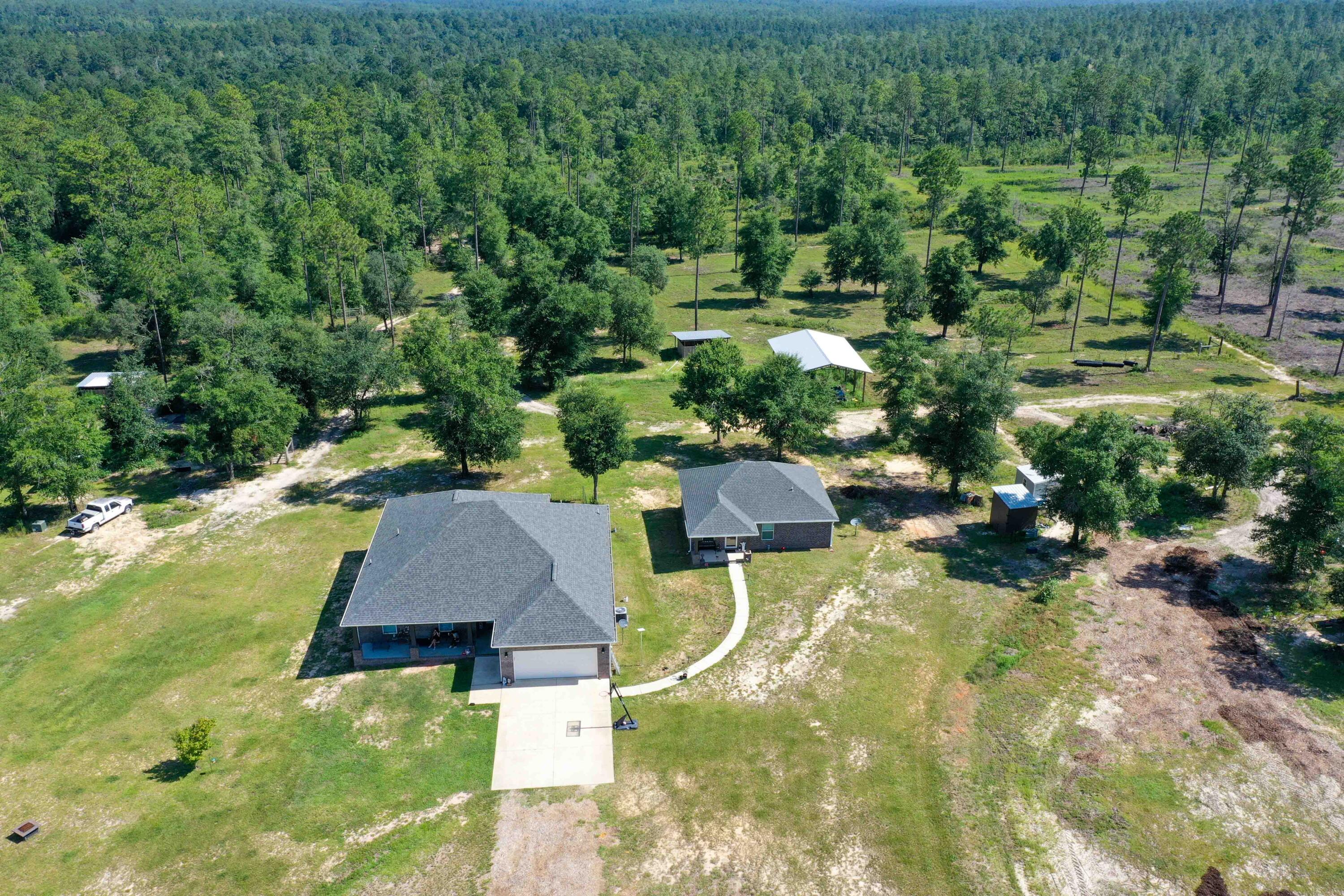 6249 Highway 4 Baker, FL 32531 - Photo 35 of 37 an aerial view of a house with yard swimming pool and outdoor seating