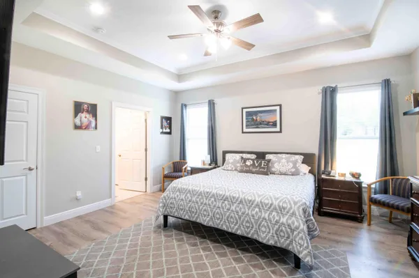 a bedroom with a bed and a couch