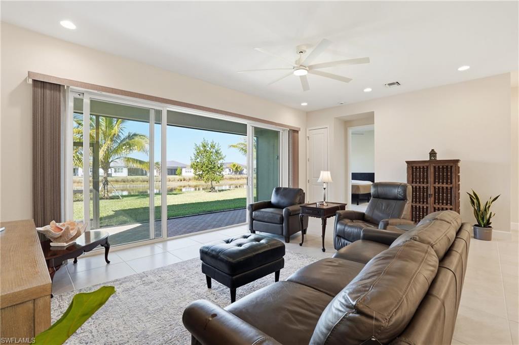 12391 Purple Ficus Way Naples, FL 34120 - Photo 11 of 44 Full rear wall of impact glass sliders