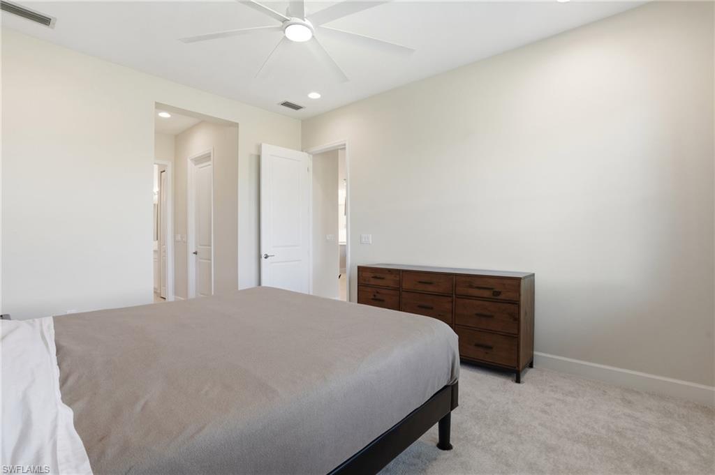12391 Purple Ficus Way Naples, FL 34120 - Photo 19 of 44 Private suite with 2 large, walk in closets leading to primary bath