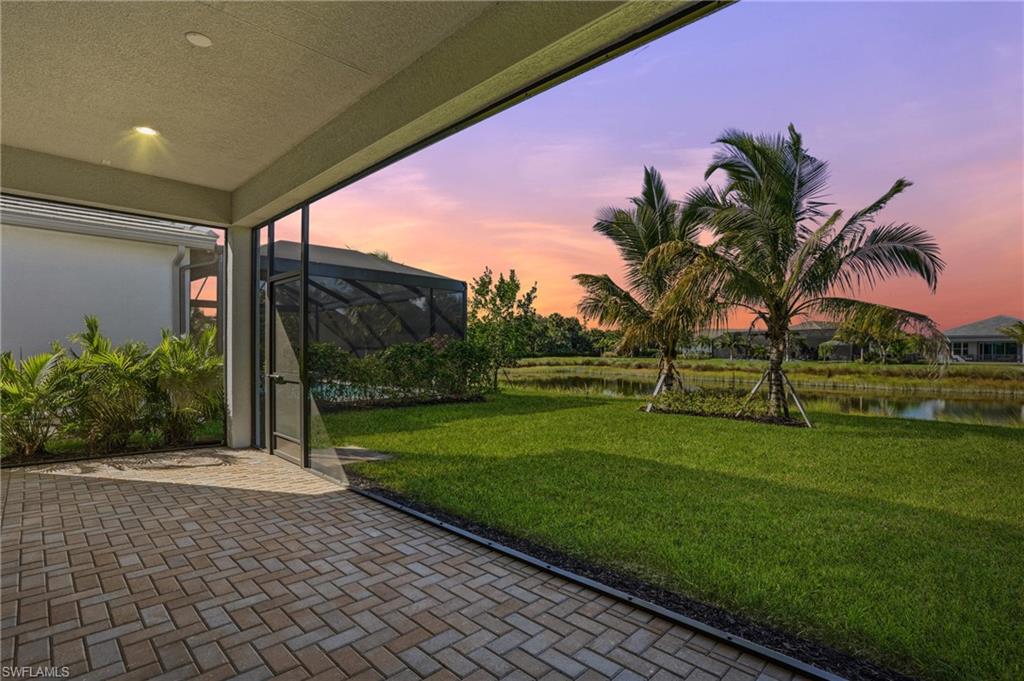 12391 Purple Ficus Way Naples, FL 34120 - Photo 2 of 44 Melt into the sunsets from your rear lanai.