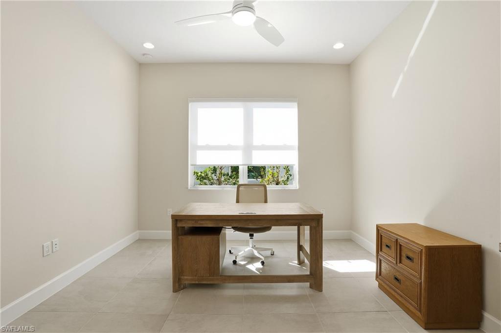 12391 Purple Ficus Way Naples, FL 34120 - Photo 22 of 47 an empty room with a window