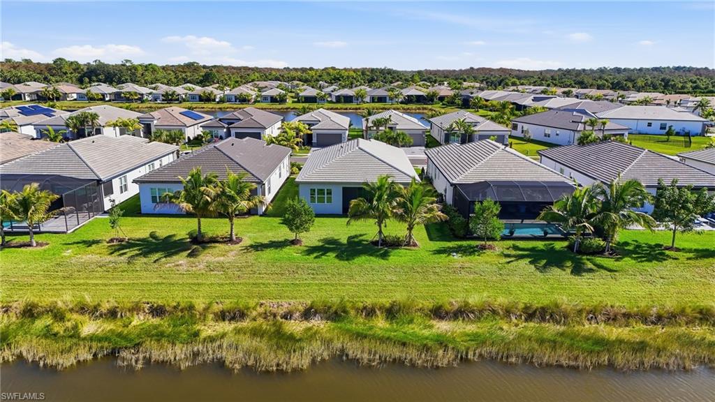 12391 Purple Ficus Way Naples, FL 34120 - Photo 32 of 44 View of the rear Flamingo situated on the lake