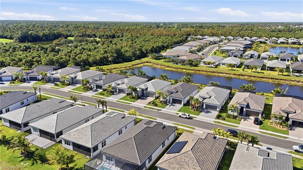 12391 Purple Ficus Way Naples, FL 34120 - Photo 38 of 47 an aerial view of a house with a garden