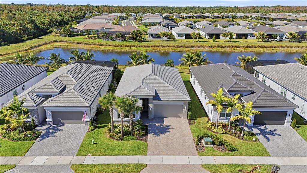 12391 Purple Ficus Way Naples, FL 34120 - Photo 44 of 47 an aerial view of a house with a garden