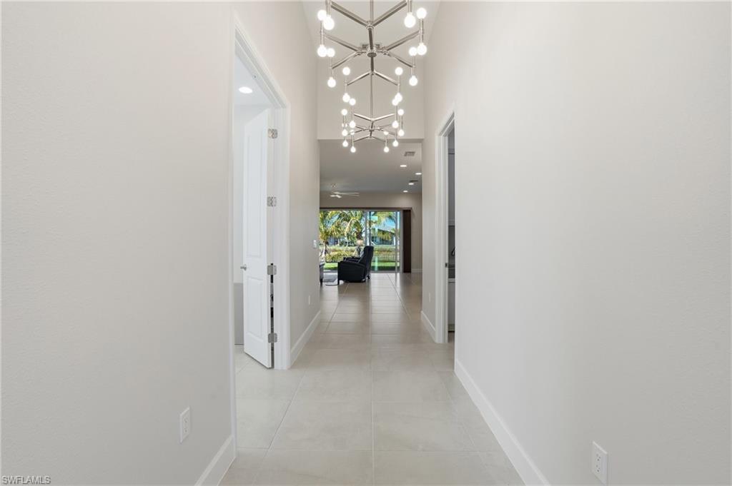 12391 Purple Ficus Way Naples, FL 34120 - Photo 7 of 44 The WOW factor hits hard when you step into the Flamingo