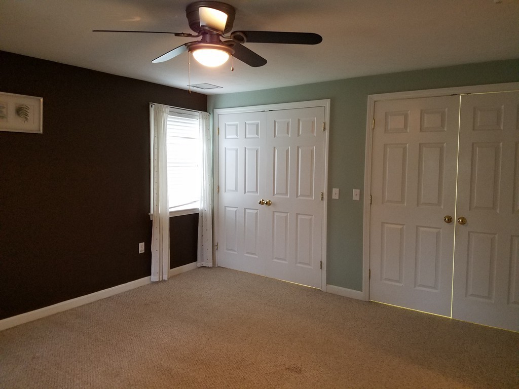 2 Erick Road Mansfield, MA 02048 - Photo 12 of 25 an empty room with closet and a chandelier fan