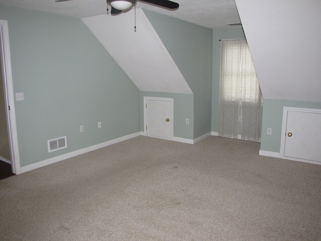 2 Erick Road Mansfield, MA 02048 - Photo 13 of 25 an empty room with windows and cabinet