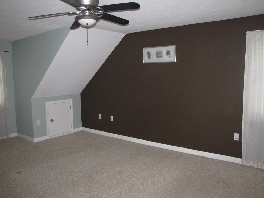 2 Erick Road Mansfield, MA 02048 - Photo 14 of 25 an empty room with a ceiling fan and a fan