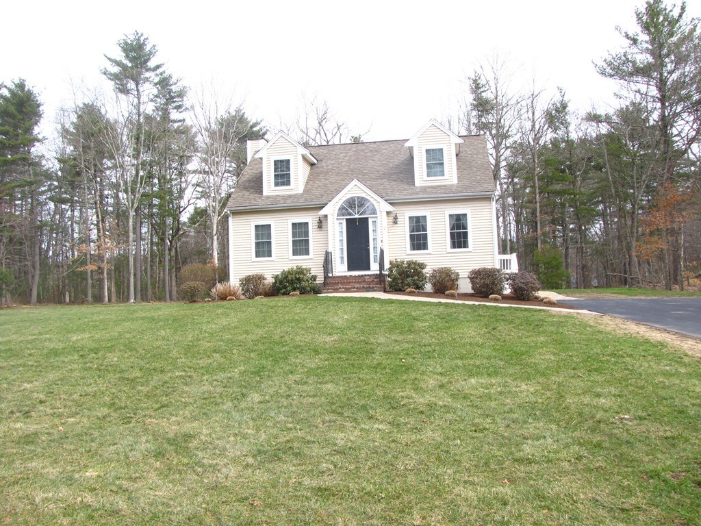 2 Erick Road Mansfield, MA 02048 - Photo 2 of 25 a front view of a house with a garden