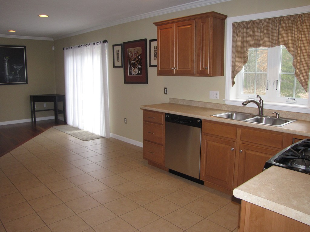 2 Erick Road Mansfield, MA 02048 - Photo 3 of 25 a kitchen with a sink cabinets and window