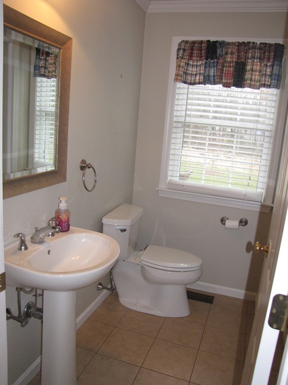 2 Erick Road Mansfield, MA 02048 - Photo 6 of 25 a bathroom with a sink toilet and a mirror