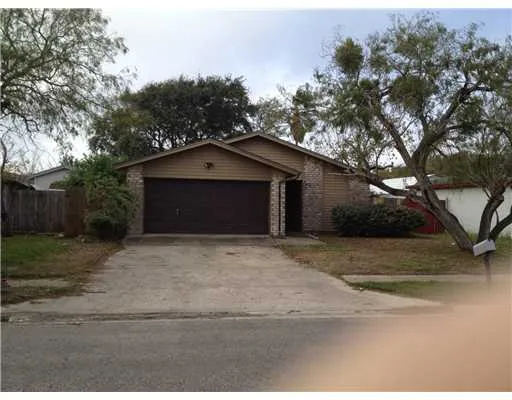 a house with trees in the background