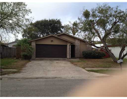 a house with trees in the background