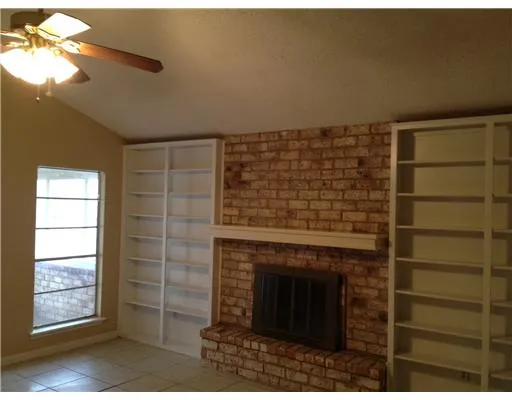 a bathroom with a shower and a fireplace