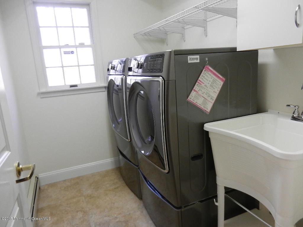 21 Statesboro Road Freehold, NJ 07728 - Photo 12 of 30 a utility room with dryer and washer