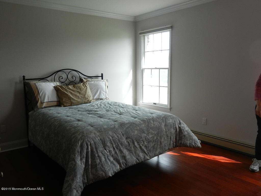 21 Statesboro Road Freehold, NJ 07728 - Photo 20 of 30 a bed sitting in a bedroom next to a window
