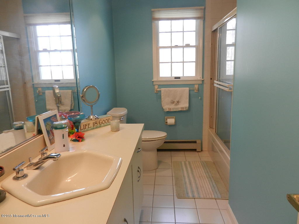 21 Statesboro Road Freehold, NJ 07728 - Photo 21 of 30 a bathroom with a sink toilet and tub