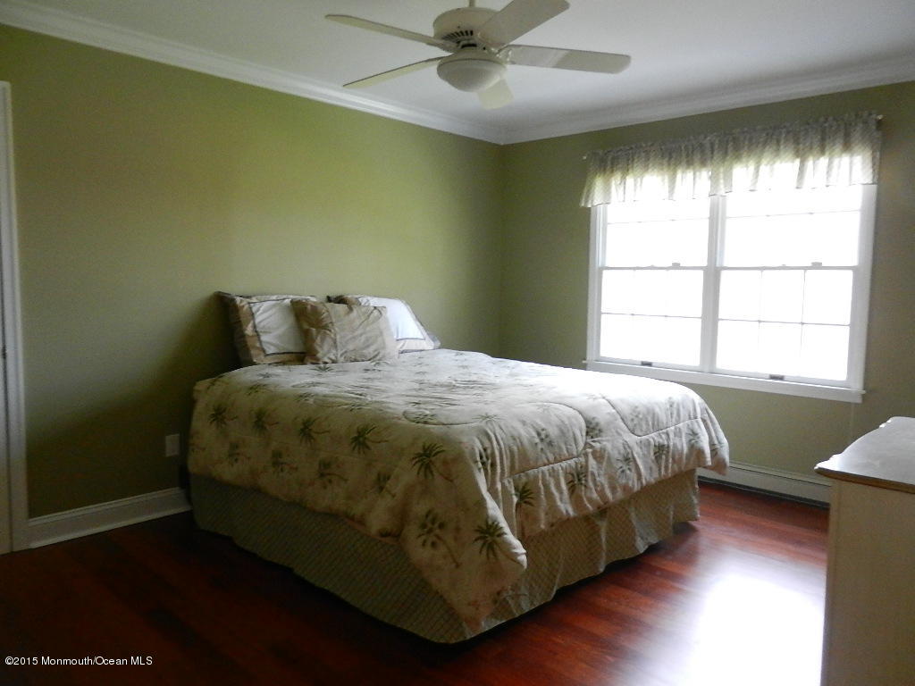 21 Statesboro Road Freehold, NJ 07728 - Photo 22 of 30 a bedroom with a bed and window