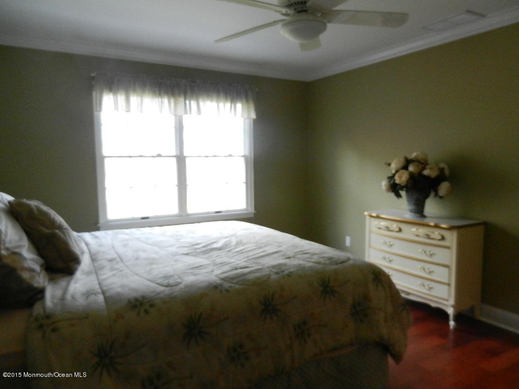 21 Statesboro Road Freehold, NJ 07728 - Photo 23 of 30 a bedroom with a bed and a window