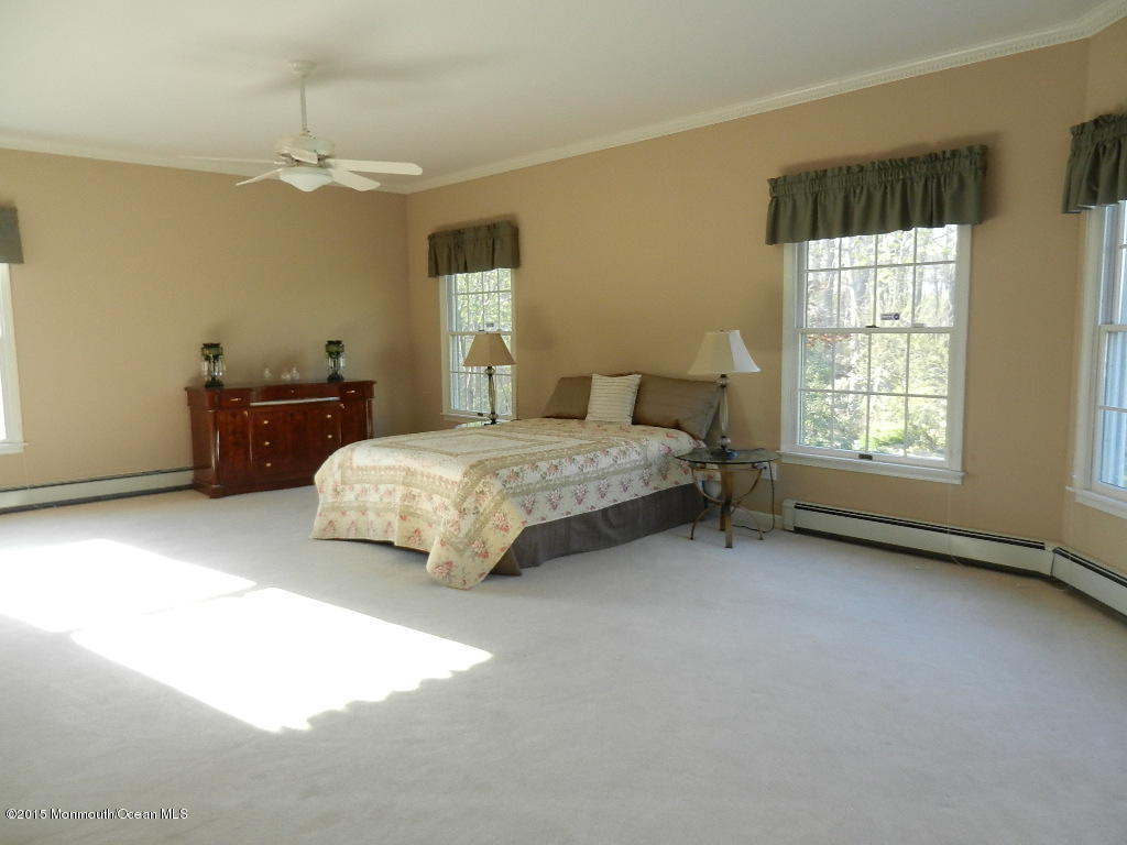 21 Statesboro Road Freehold, NJ 07728 - Photo 28 of 30 a living room with a bed furniture and a window