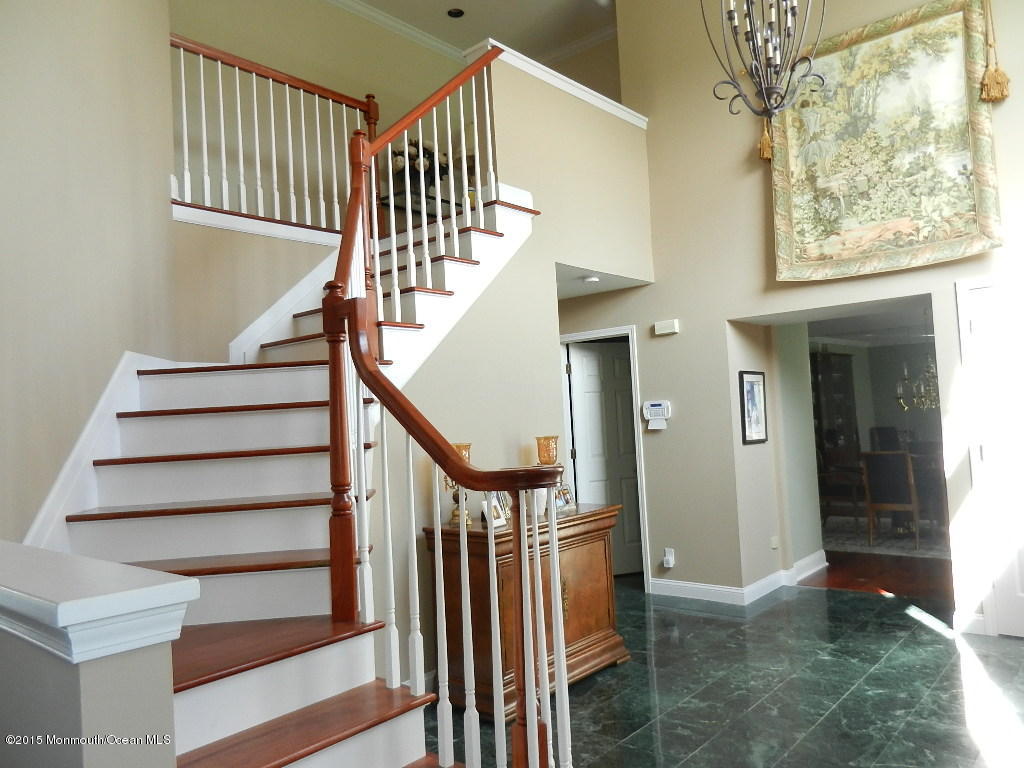 21 Statesboro Road Freehold, NJ 07728 - Photo 5 of 30 a view of entryway and hall with wooden floor