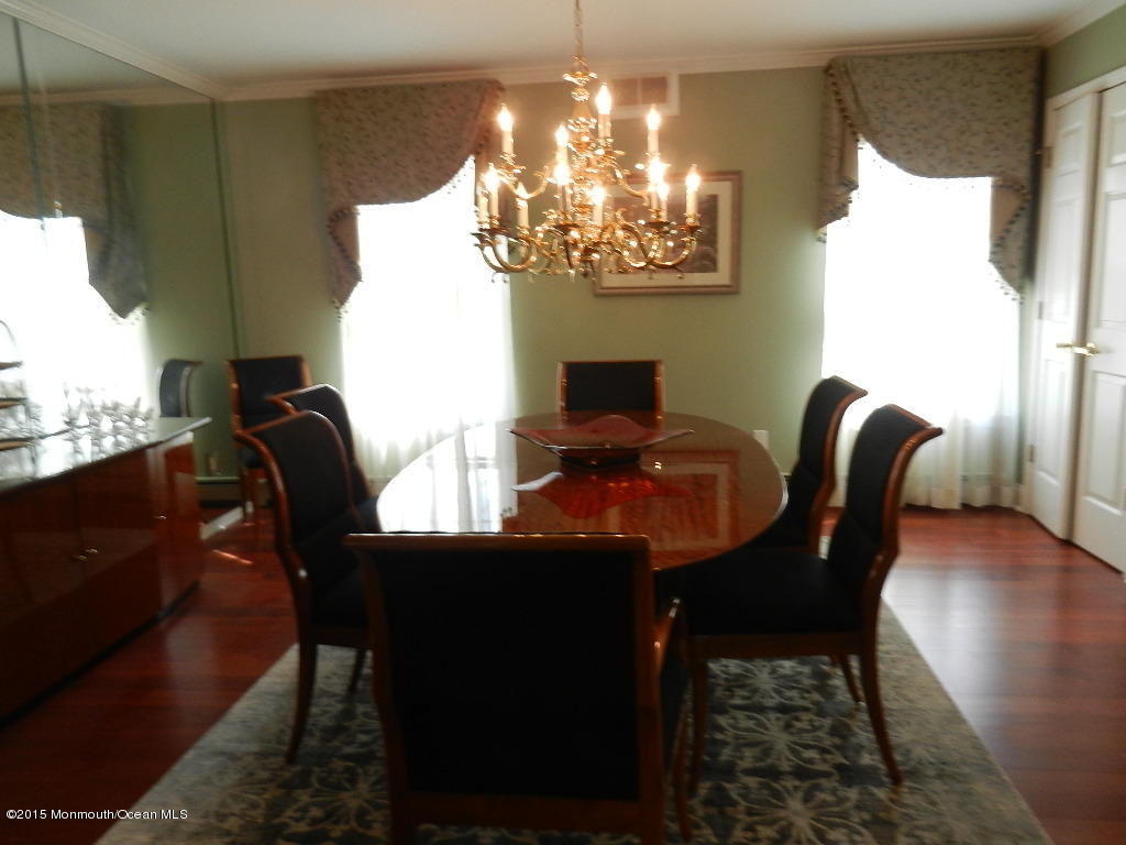 21 Statesboro Road Freehold, NJ 07728 - Photo 9 of 30 a view of a dining room with furniture and chandelier