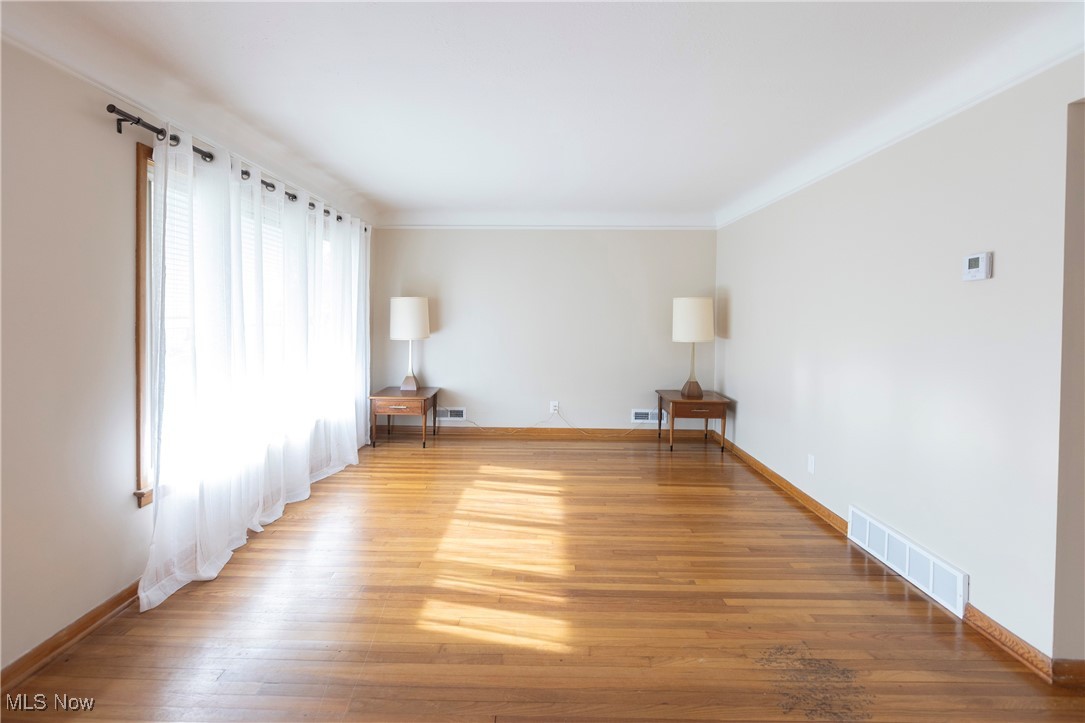 4354 Redding Road Cleveland, OH 44109 - Photo 3 of 23 Living room with coved ceiling, hardwood floors and natural woodwork.
