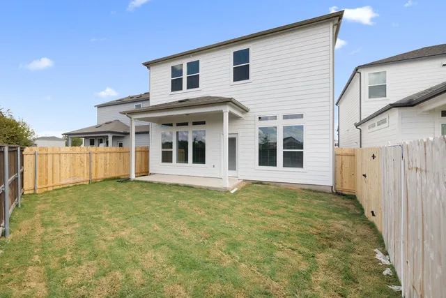 a view of a white house with a large window