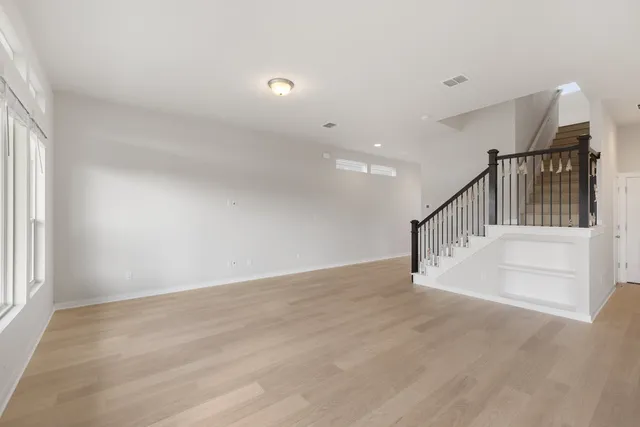 a view of an entryway with wooden floor