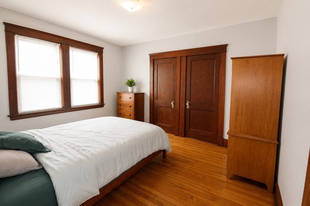 15 Herbert Road, Unit 15 Arlington, MA 02474 - Photo 7 of 9 a bedroom with a bed and a window