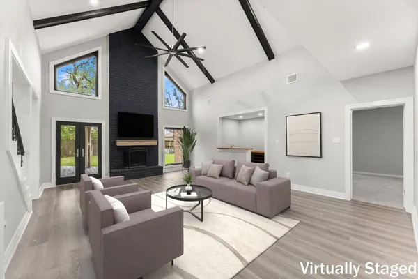 a living room with furniture and a fireplace