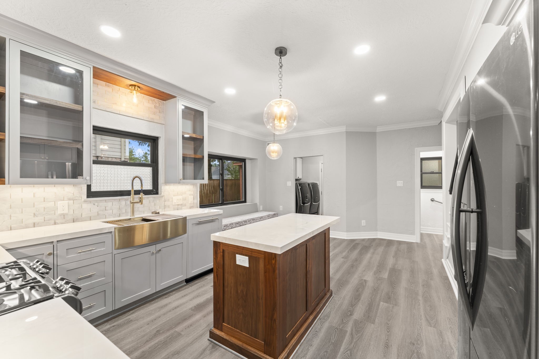 6415 Singing Creek Lane Spring, TX 77379 - Photo 11 of 29 Notice the beautiful apron sink and the wood accents on the island and shelving!