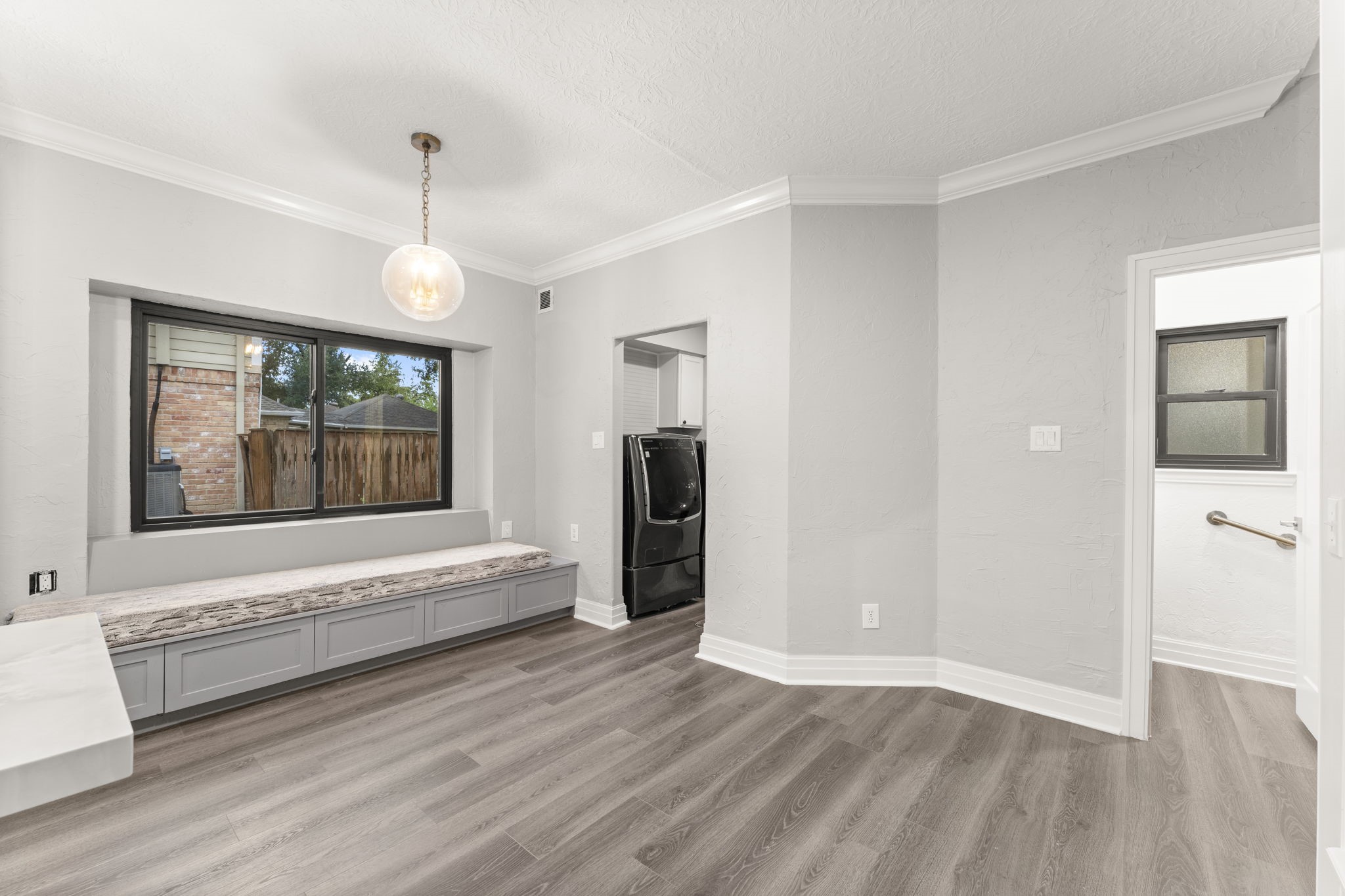 6415 Singing Creek Lane Spring, TX 77379 - Photo 13 of 29 a view of an empty room with wooden floor and a window