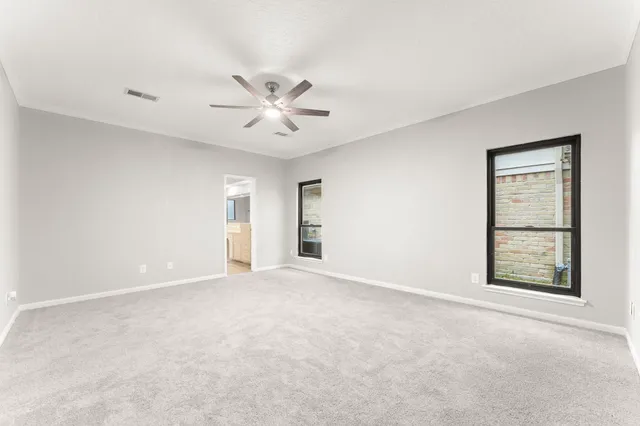 a view of an empty room with wooden walls