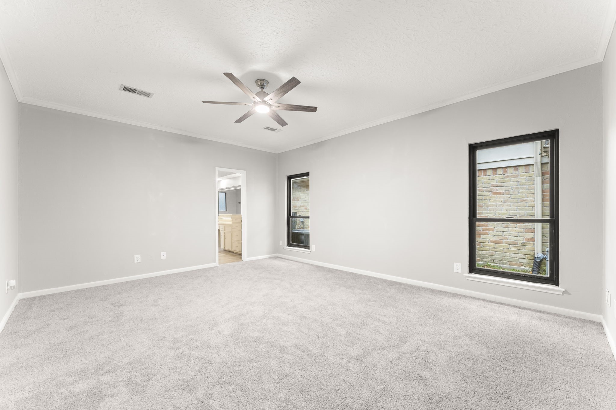 6415 Singing Creek Lane Spring, TX 77379 - Photo 16 of 29 The first primary suite is located on the first floor with new carpet, paint and windows.