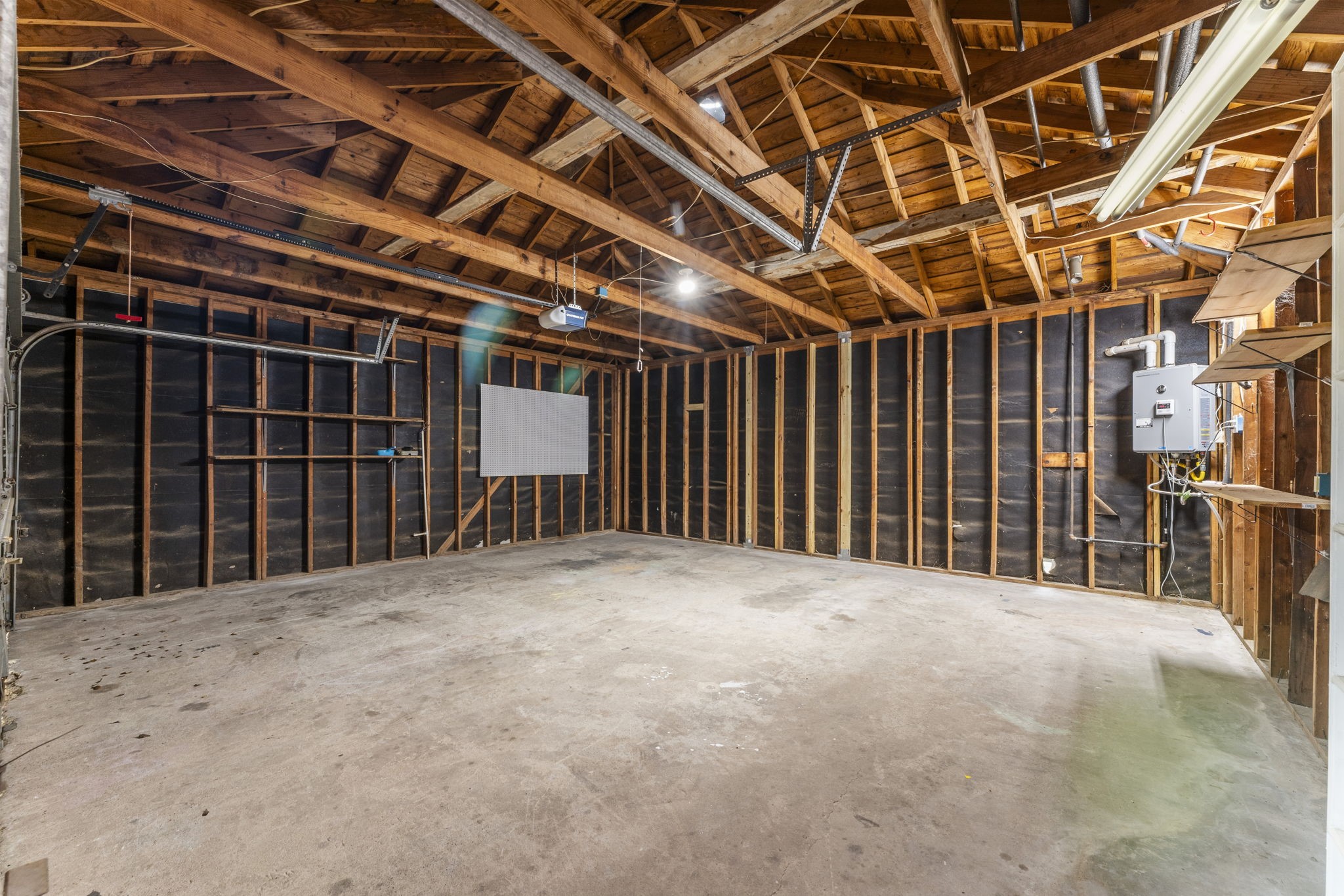 6415 Singing Creek Lane Spring, TX 77379 - Photo 26 of 29 a view of an empty room with wooden walls