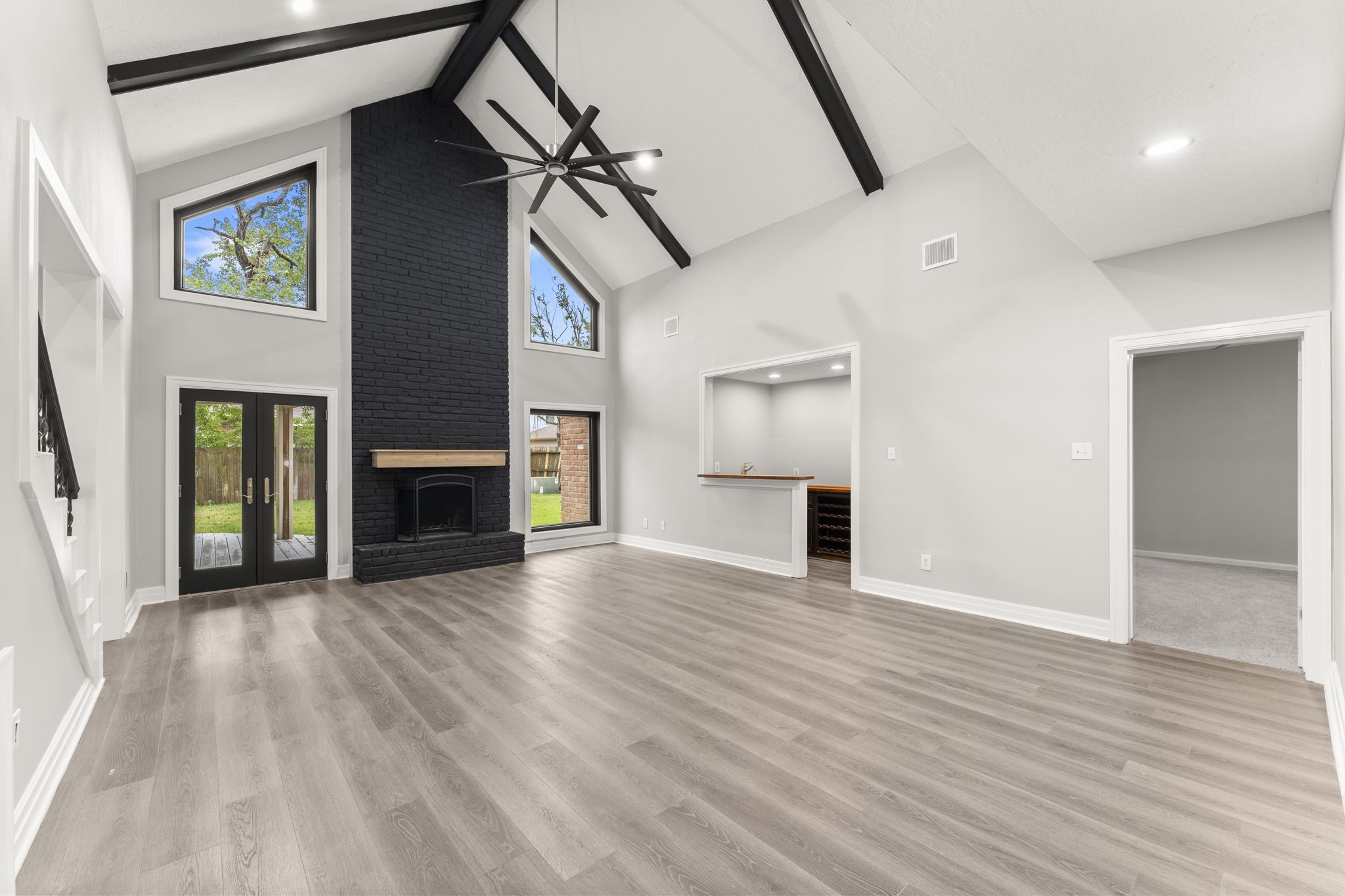 6415 Singing Creek Lane Spring, TX 77379 - Photo 8 of 34 Living room with stunning windows and french doors.