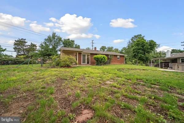 a view of a house with yard and a garden