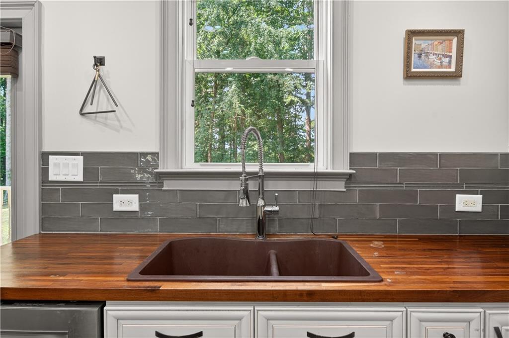 632 Geiger Road Jefferson, GA 30549 - Photo 20 of 55 a view of a kitchen with a sink and cabinets