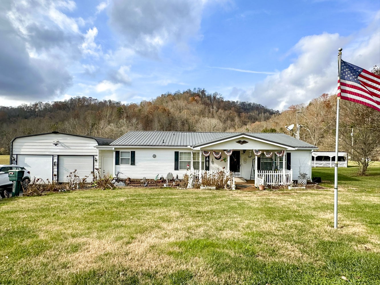 2641 Stanley Valley Road Surgoinsville, TN 37873 - Photo 2 of 26 a front view of a house with a yard