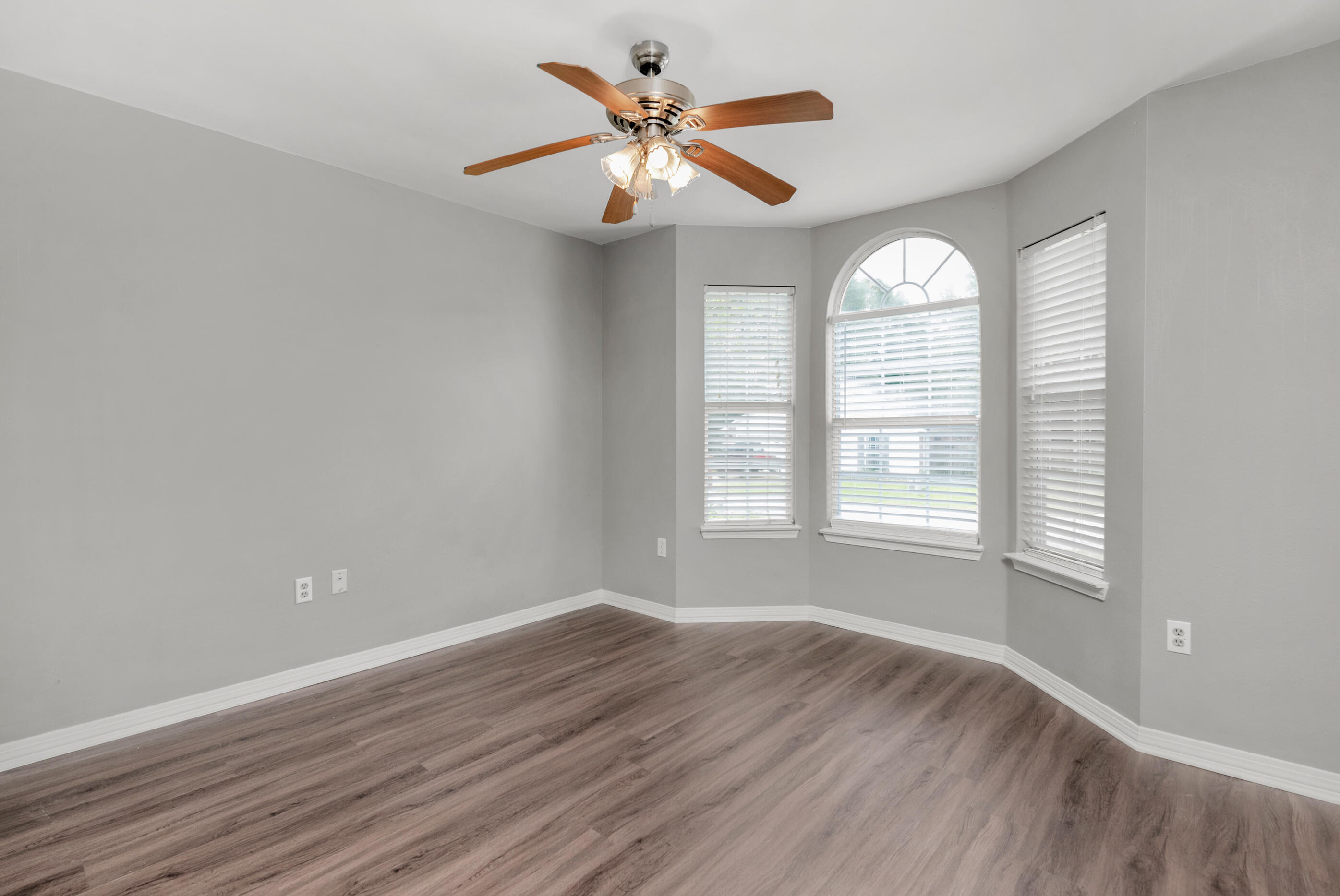 2805 Ping Lane Crestview, FL 32539 - Photo 15 of 30 wooden floor in an empty room with a window
