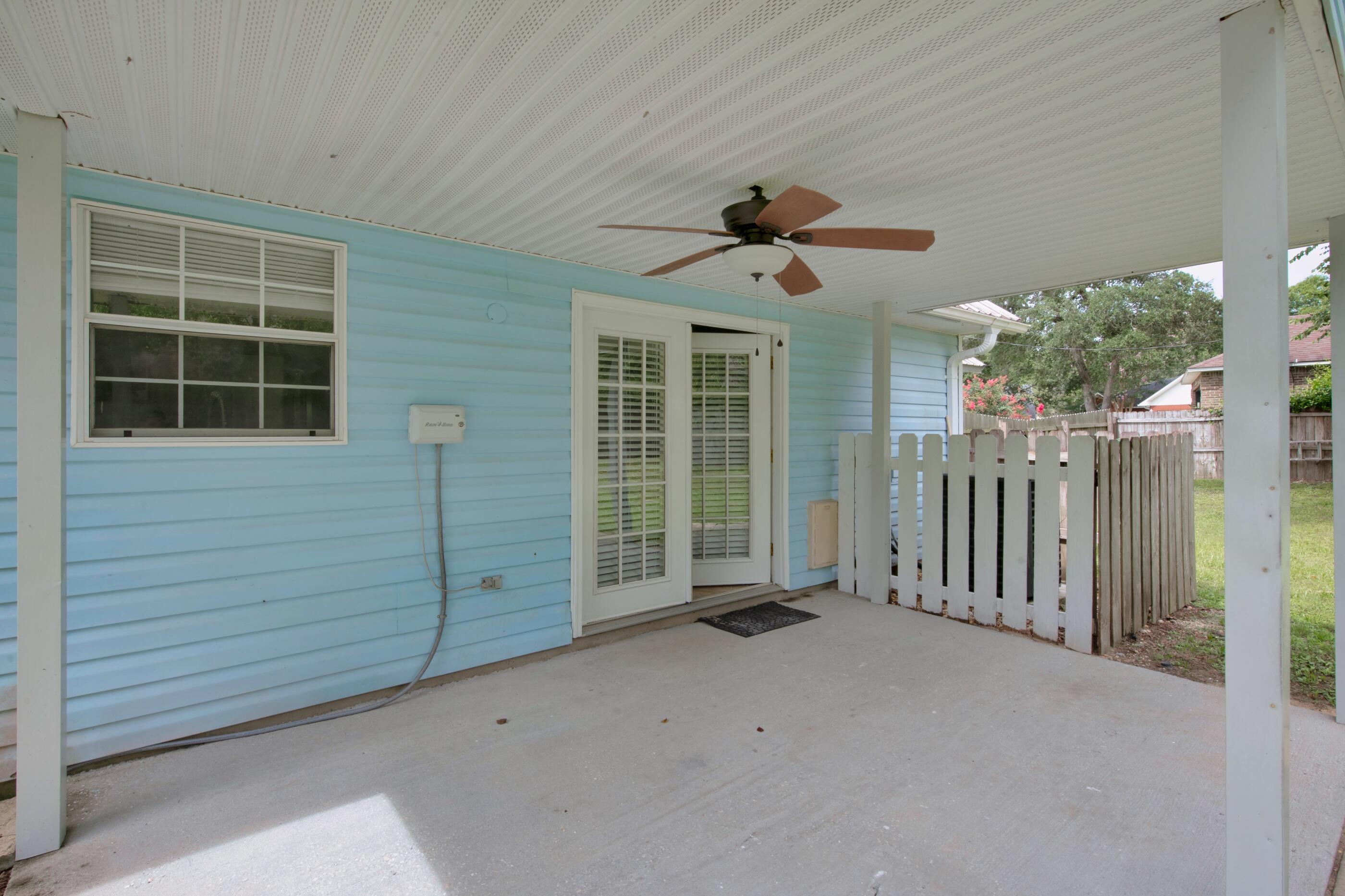 2805 Ping Lane Crestview, FL 32539 - Photo 24 of 30 a view of a room with a ceiling fan and windows