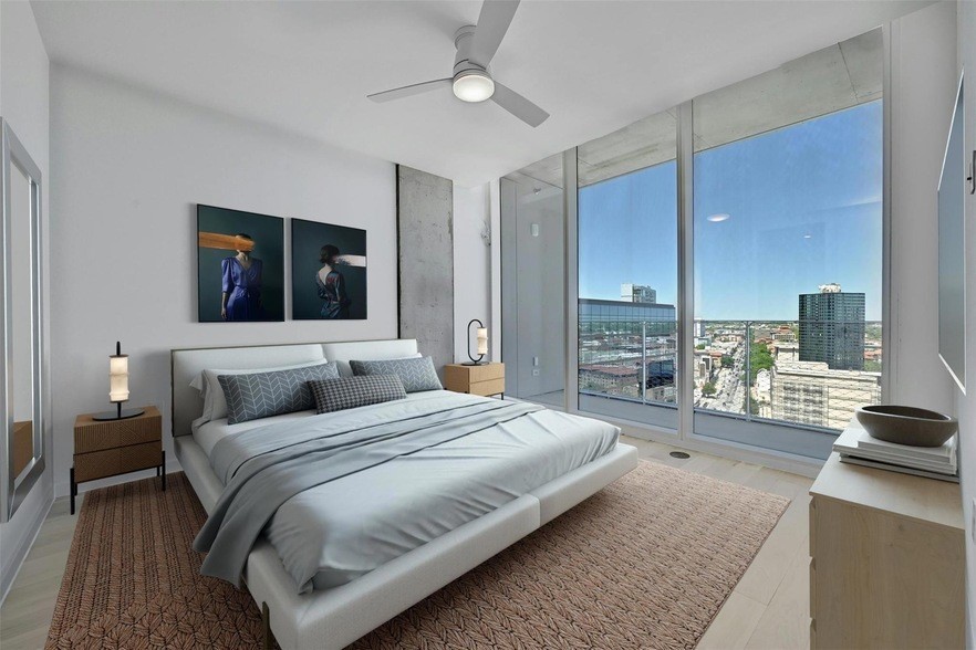 313 West 17th Street, Unit 2003 Austin, TX 78701 - Photo 16 of 25 a bedroom with a bed couch and a view of kitchen