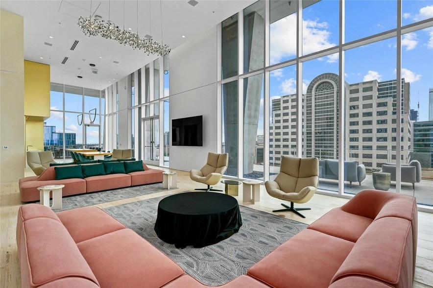 313 West 17th Street, Unit 2003 Austin, TX 78701 - Photo 10 of 25 a living room with furniture cabinets and a fireplace