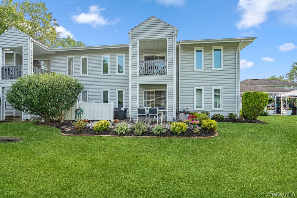 914 Fenway Road St. James, NY 11780 - Photo 29 of 35 a front view of house with yard and green space